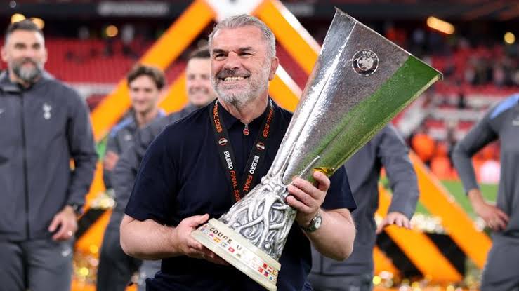 Coach Ange Postecoglou with the Europa League trophy at Tottenham 