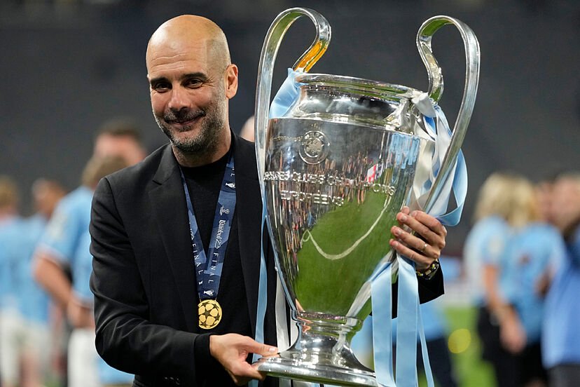 guardiola with ucl trophy