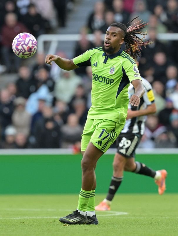 alex iwobi in action against newcastle united