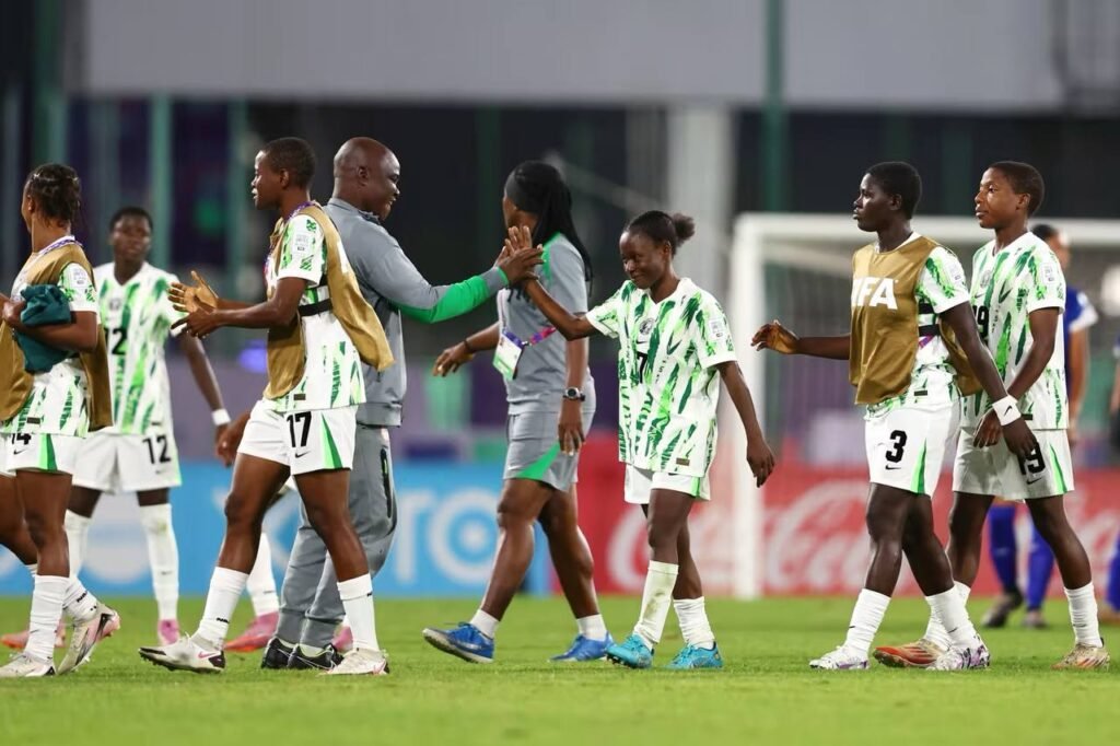 Nigeria Coach Olowookere celebrating with the players after win