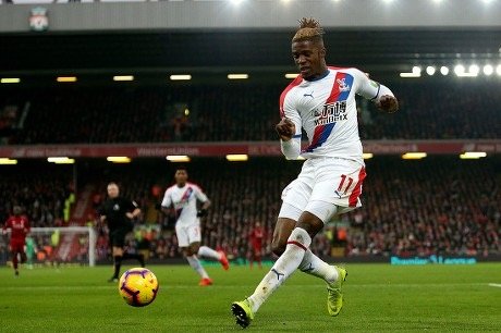 wilfried zaha in action for crystal palace in the epl