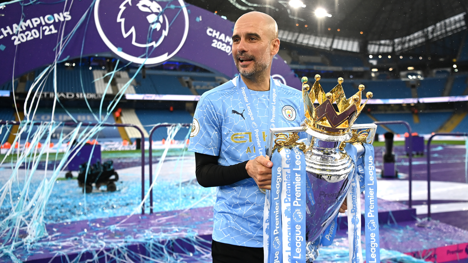 pep guardiola with epl trophy