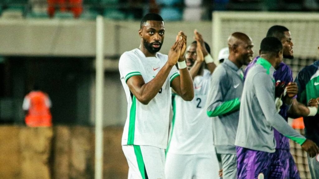 A photo of Semi Ajayi in Super Egales jersey applauding the fans
