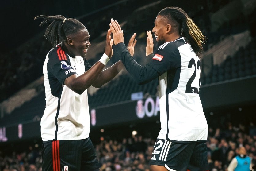 calvin bassey and alex iwobi celebrating a goal for fulham
