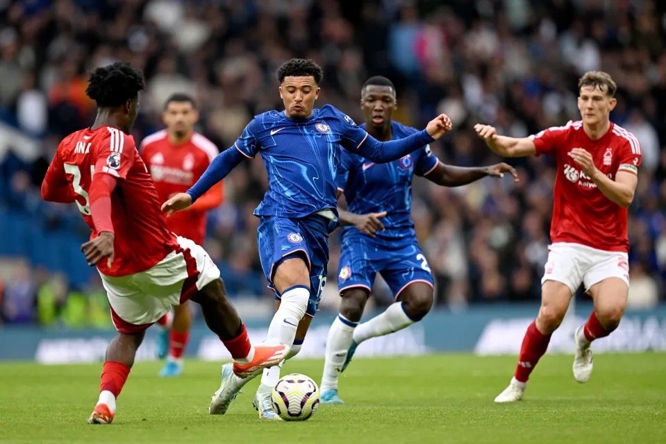 nottingham forest ola aina in action against jadon sancho in the 2024-25 season