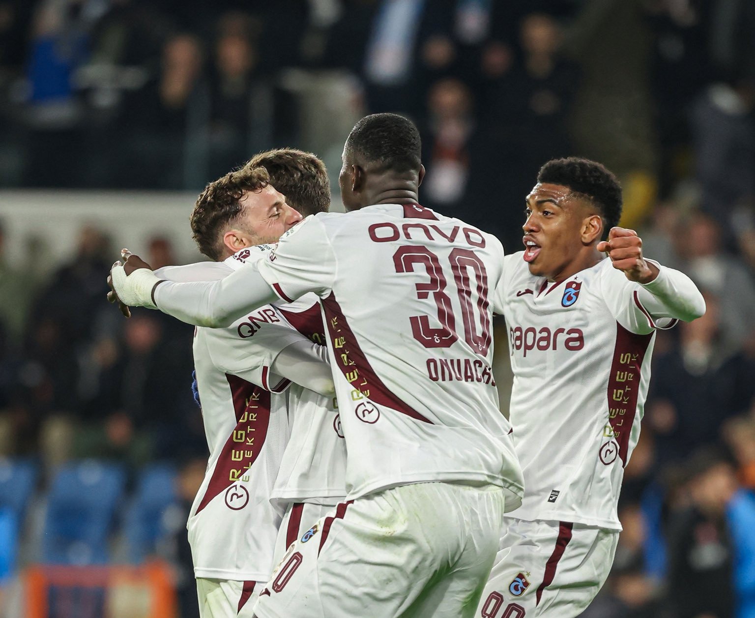 paul onuachu celebrating a goal with his trabzonspor teammates