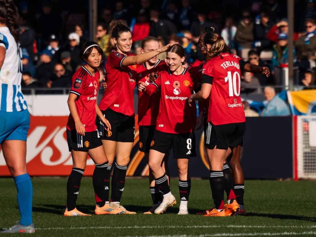 Man United Jess Park celebrates with team mate after scoring against Brighton in WSL