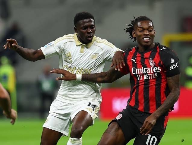 ebenezer akinsanmiro battles with ac milan rafael leao for the ball
