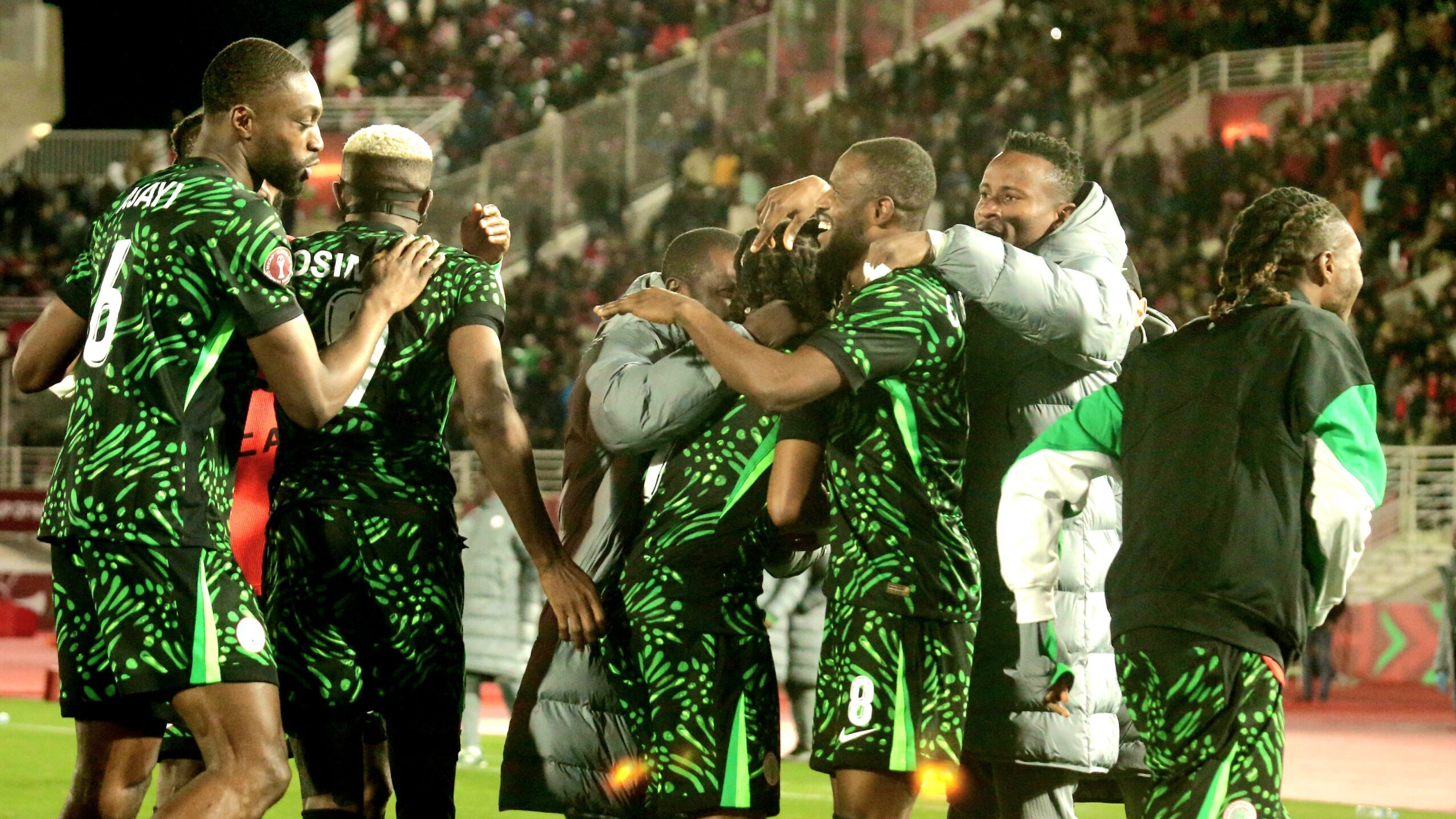 super eagles players celebrate a goal