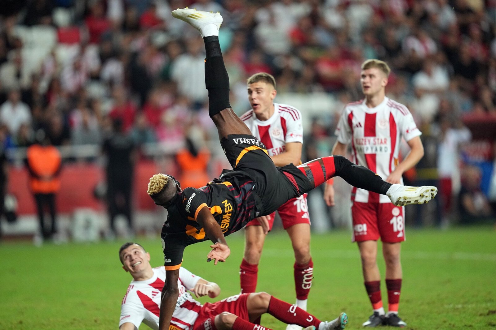 galatasaray striker victor osimhen attempts a bicycle kick during a match