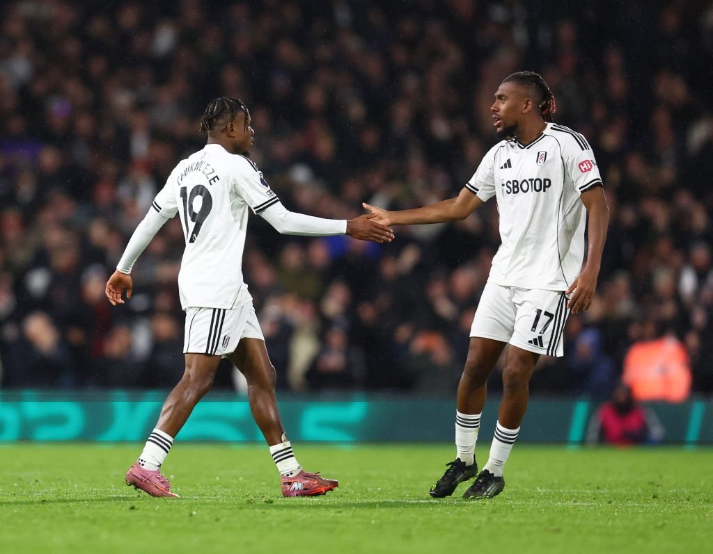 samuel chukwueze celebrates with alex iwobi after scoring for fulham against man city