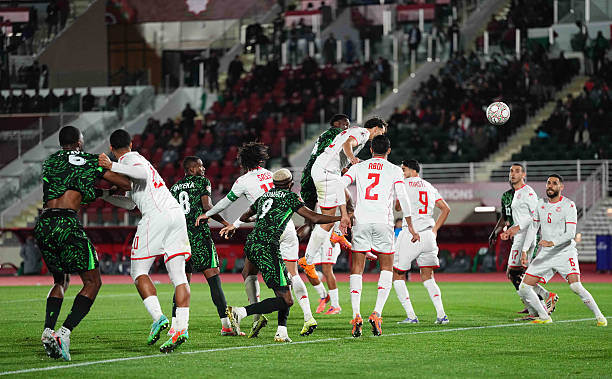 tunisian players compete for a ball with the nigerian players during their group c clash at afcon 2025