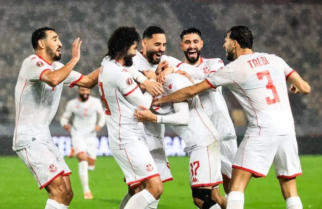 tunisia players celebrating a goal