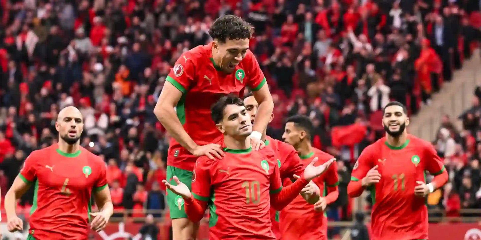 morocco players celebrating a goal against comoros at afcon 2025