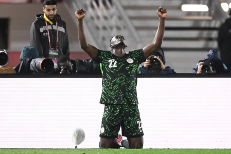 akor adams points to the sky after scoring for nigeria against mozambique