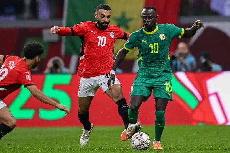 mohamed salah in action for egypt against sadio mane of senegal