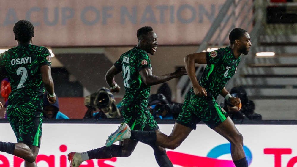osayi-samuel, akor adams and semi ajayi celebrate a goal for nigeria