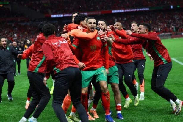 morocco players celebrate shootout win over nigeria