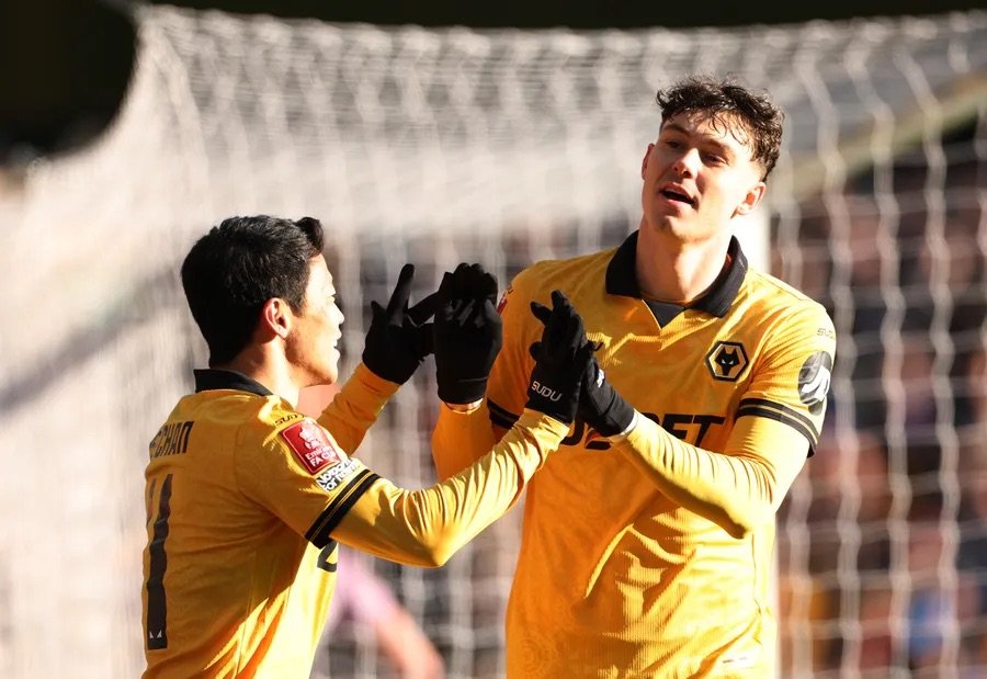jorgen strand larsen and hwang hee-chan celebrate a goal for wolves