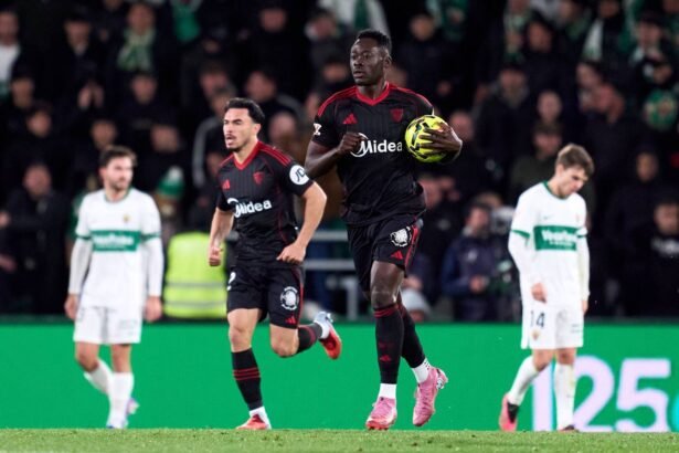 Akor Adams celebrates with the ball after scoring for Sevilla against Elche in LaLiga