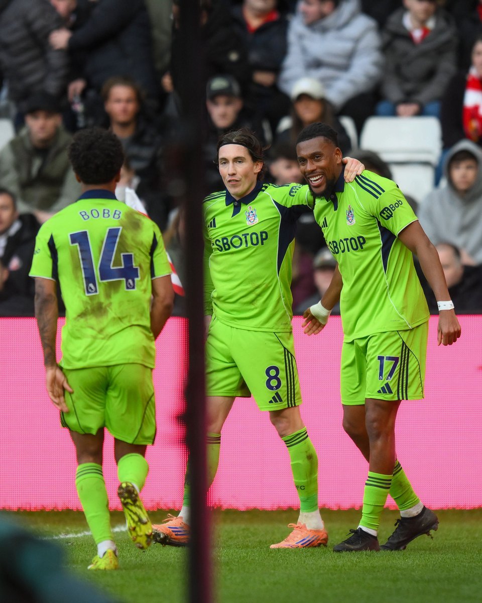 alex iwobi celebrates with harry wilson and oscar bobb for fulham