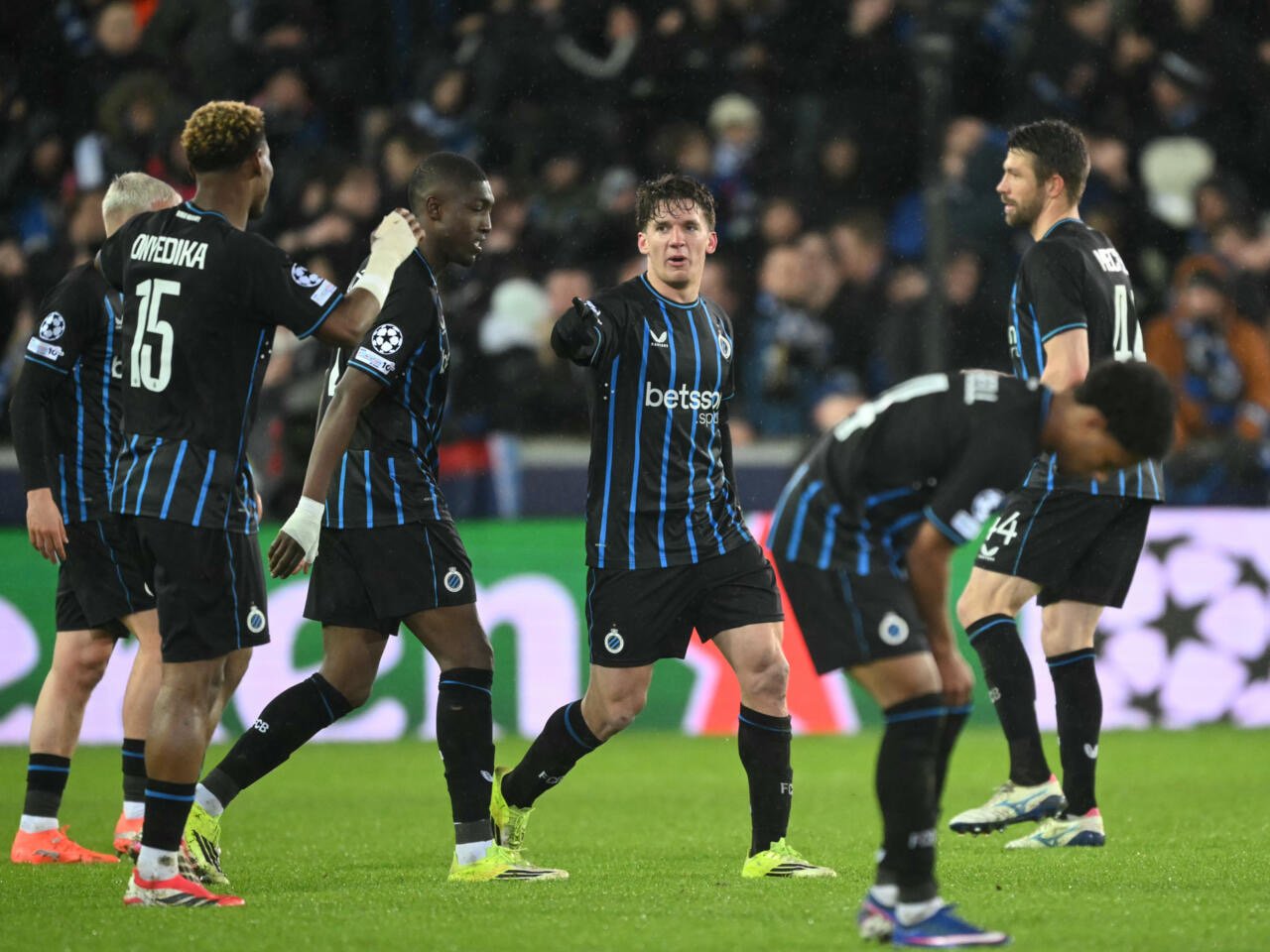 raphael onyedika celebrates a goal with his teammates during club brugge champions league match against atletico madrid