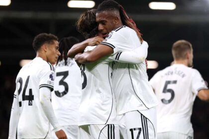 alex iwobi celebrates with his teammates at fulham