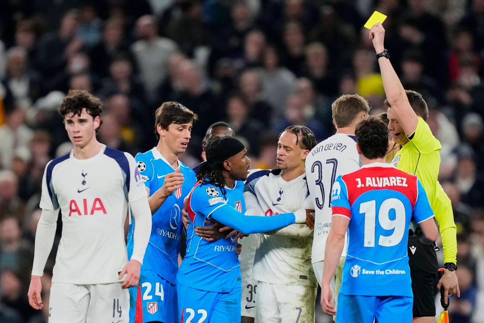 ademola lookman receives a yellow card during atletico madrid’s champions league round of 16 second leg clash against tottenham