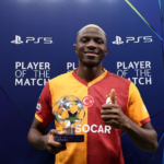 victor osimhen with a player of the match award for galatasaray after a champions league match
