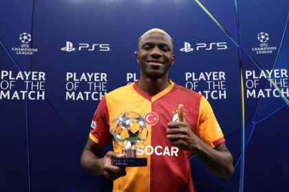 victor osimhen with a player of the match award for galatasaray after a champions league match
