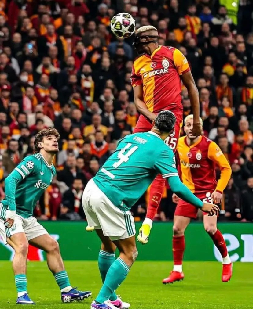 liverpool duo milos kerkez and virgil van dijk watches on as victor osimhen makes an incredible jump during their champions league clash against galatasaray