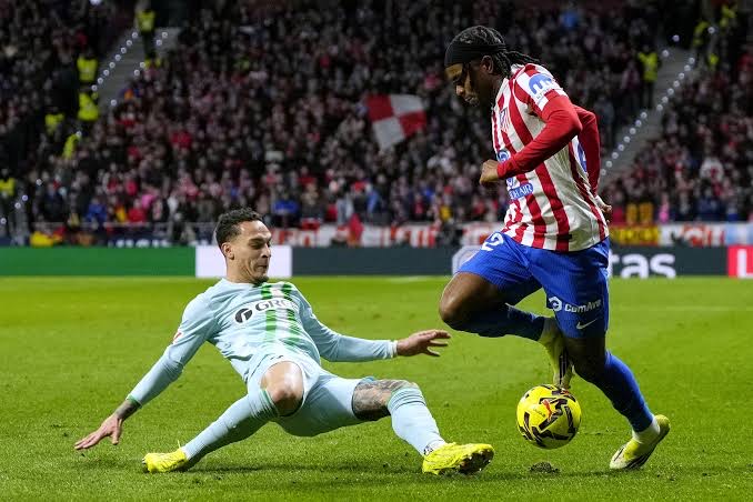 atletico madrid forward ademola lookman against real betis forward antony