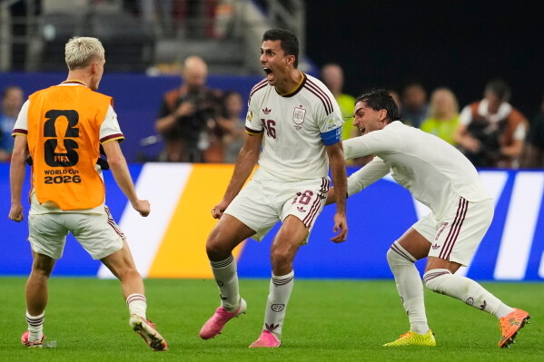 rodri celebrates with spain teammates
